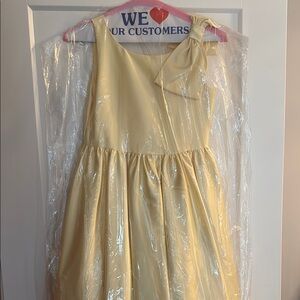 Elegant Yellow Sleeveless Dress with Bow